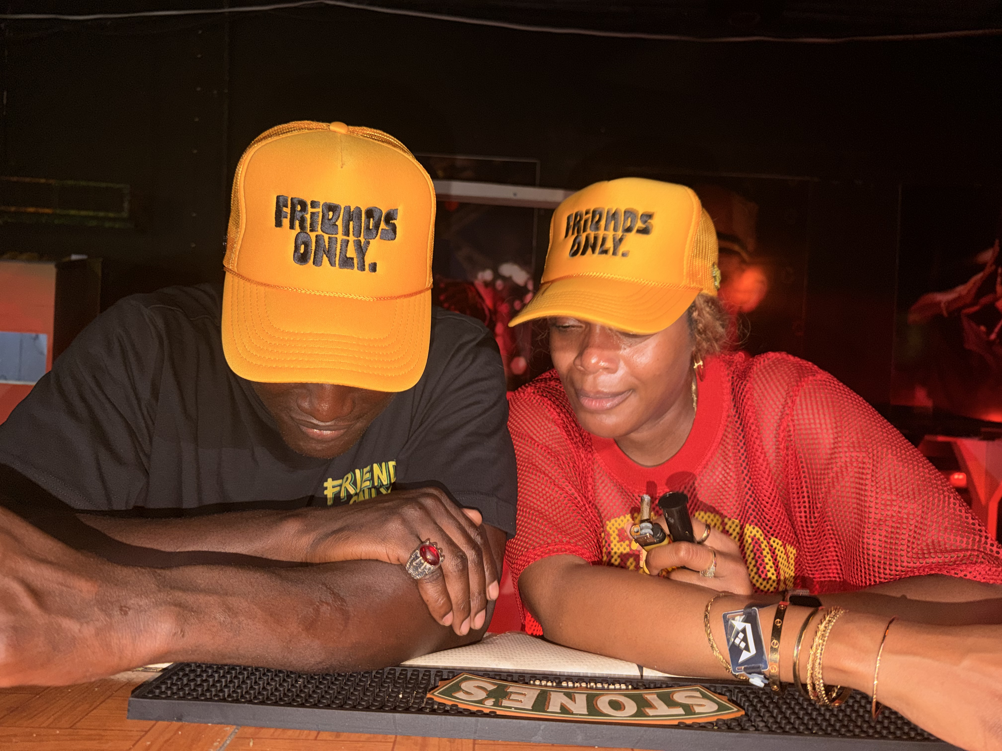 Two women yellow hats